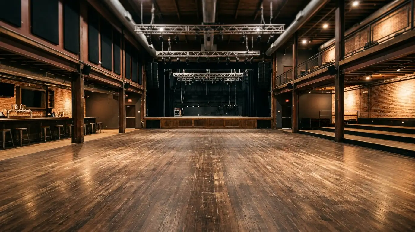 An empty standing room floor showing the concrete surface you will be on all night