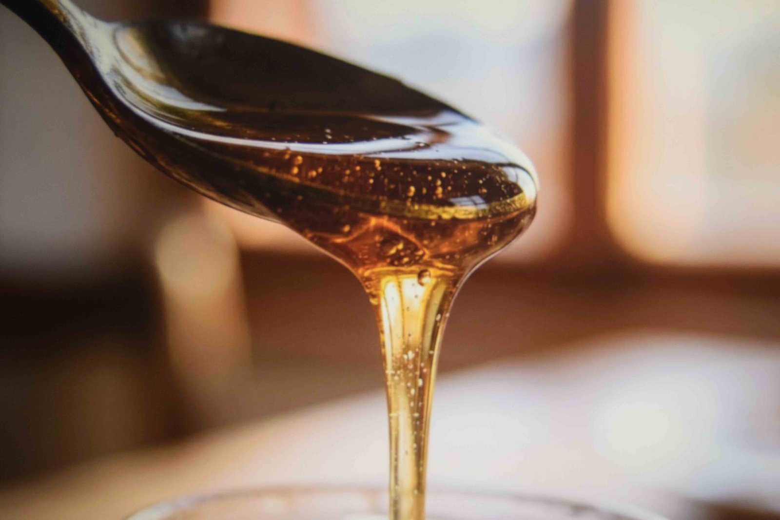 Raw honey stirred into the strained liquid to balance the acidity
