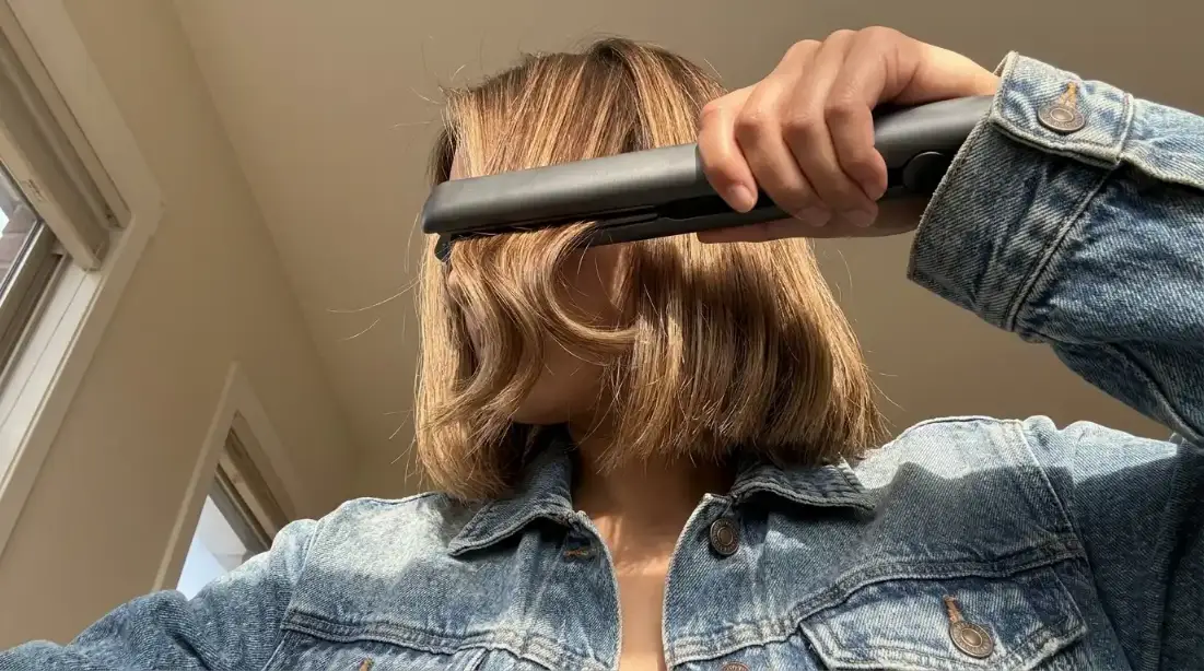 Creating subtle S-waves on a blunt cut with a flat iron.